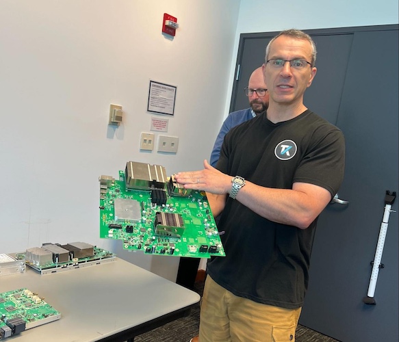 Gene Markozen holding a PCB.