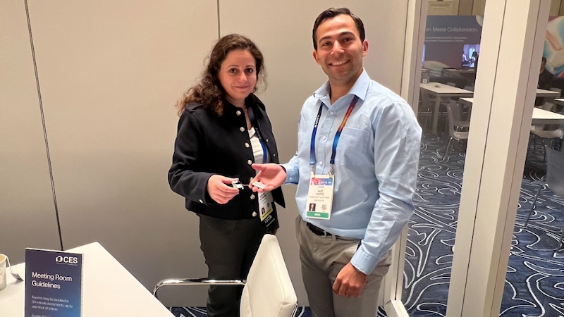 Mouna Elkhatib (left) and Jake Hertz (right) holding an AON1120 evaluation kit