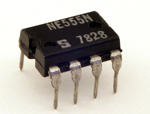 Signetics NE555 in an eight-pin DIP package