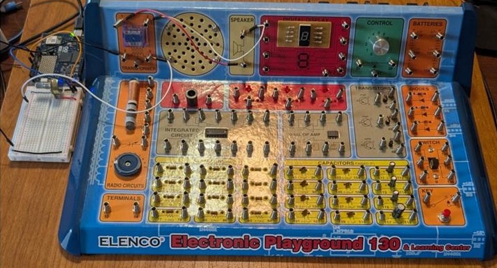 The DDS Sine Wave Generator connected to an Elenco Playground kit for audio output.